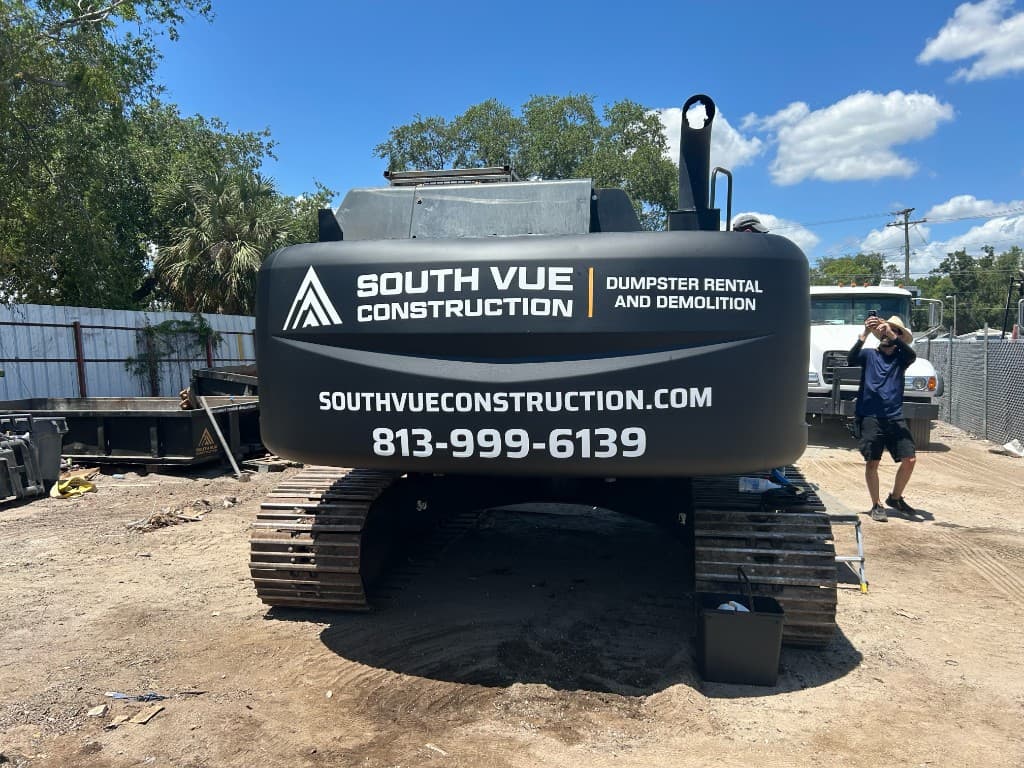 South Vue Construction branded tracked excavator on a cleared lot