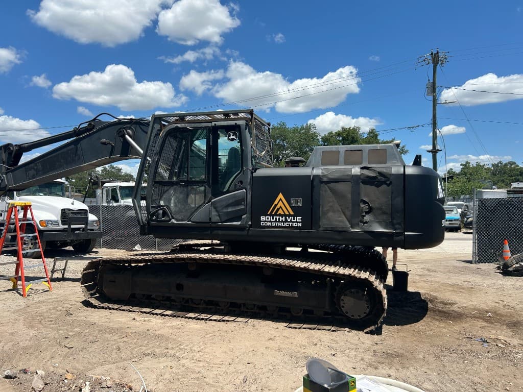 South Vue Construction branded tracked excavator on a cleared lot