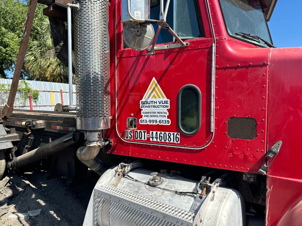 South Vue Construction red dump truck used for debris haul-off